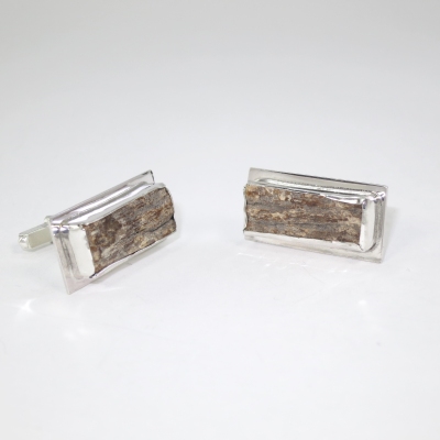 Silver cufflinks mounted with mammoth tusk